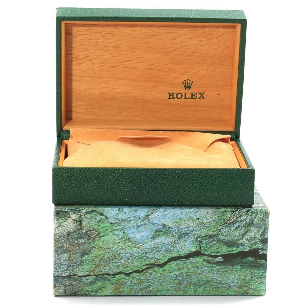 The image shows an open Rolex Explorer 16570 Men's Stainless Steel White Dial 16570 Men's Stainless Steel White Dial watch box with an outer decorative sleeve, revealing its interior.