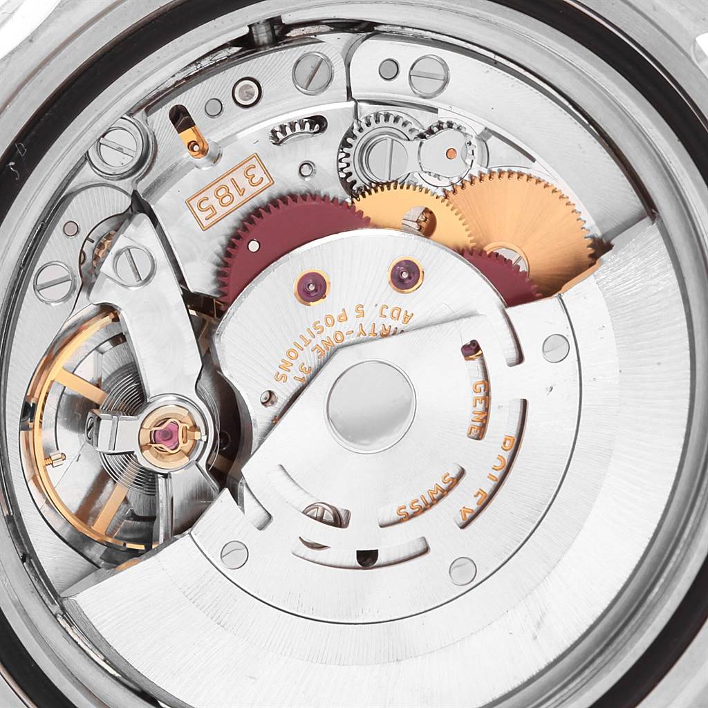 The image shows a close-up of the movement mechanism inside a Rolex Explorer 16570 Men's Stainless Steel White Dial 16570 Men's Stainless Steel White Dial watch, highlighting its gears and intricate components.