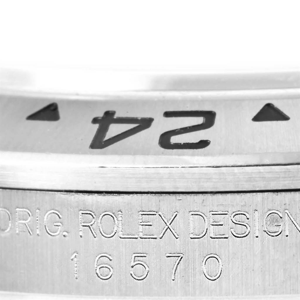 This close-up image shows the engraved bezel and case side of the Rolex Explorer 16570 Men's Stainless Steel White Dial 16570 Men's Stainless Steel White Dial model.
