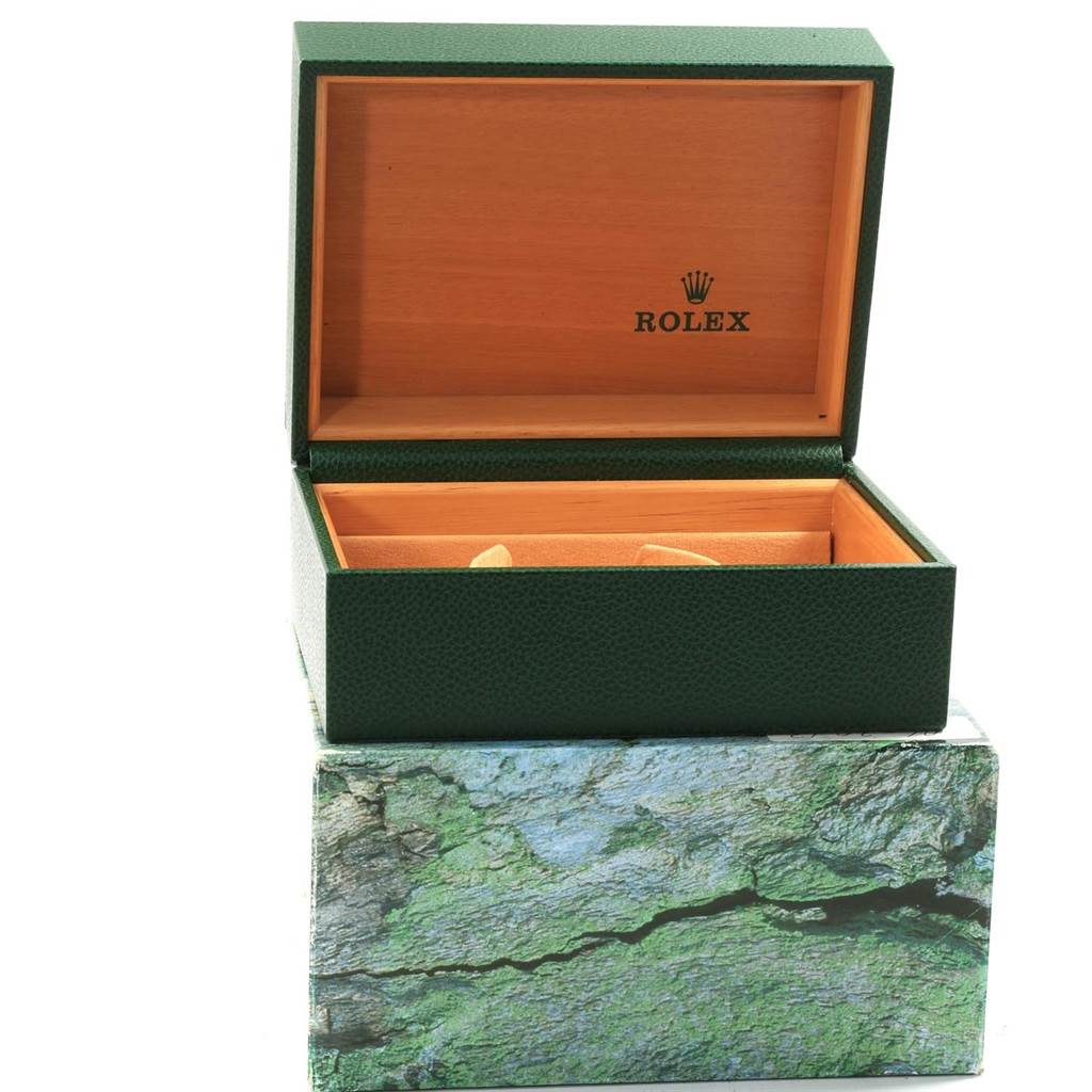 The image shows an open Rolex Explorer 16570 Men's Stainless Steel White Dial 16570 Men's Stainless Steel White Dial watch box with a green exterior and wooden interior, viewed from the front.