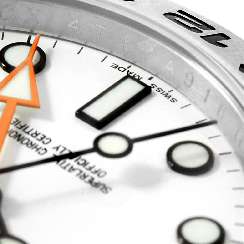 This close-up angle shows the face, hands, and part of the bezel of the Rolex Explorer 216570 Men's Stainless Steel White Dial 216570 Men's Stainless Steel White Dial watch.