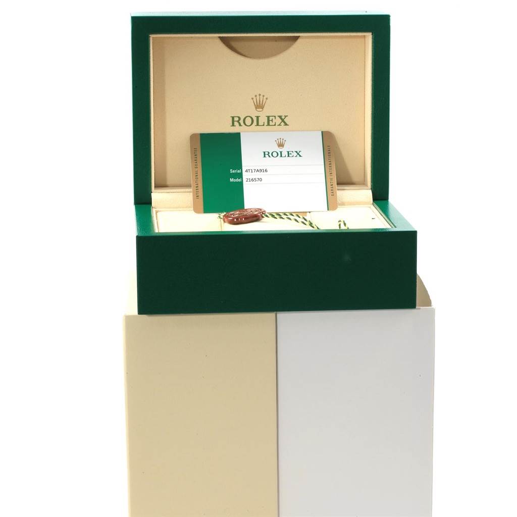 The image shows an open Rolex Explorer 216570 Men's Stainless Steel White Dial 216570 Men's Stainless Steel White Dial box with the watch certification card visible inside.