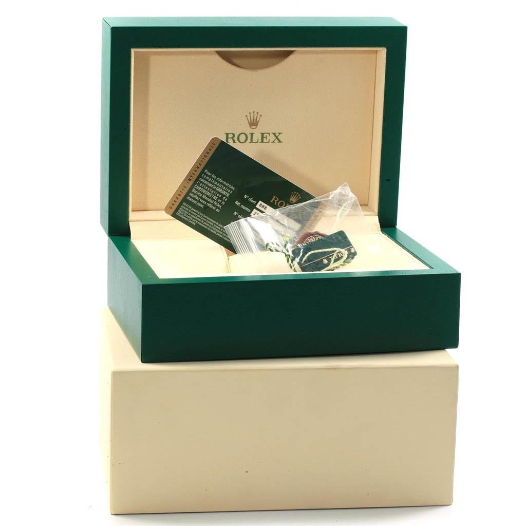 The image shows the packaging of a Rolex Explorer 216570 Men's Stainless Steel White Dial 216570 Men's Stainless Steel White Dial model watch with its box, warranty card, and tags.