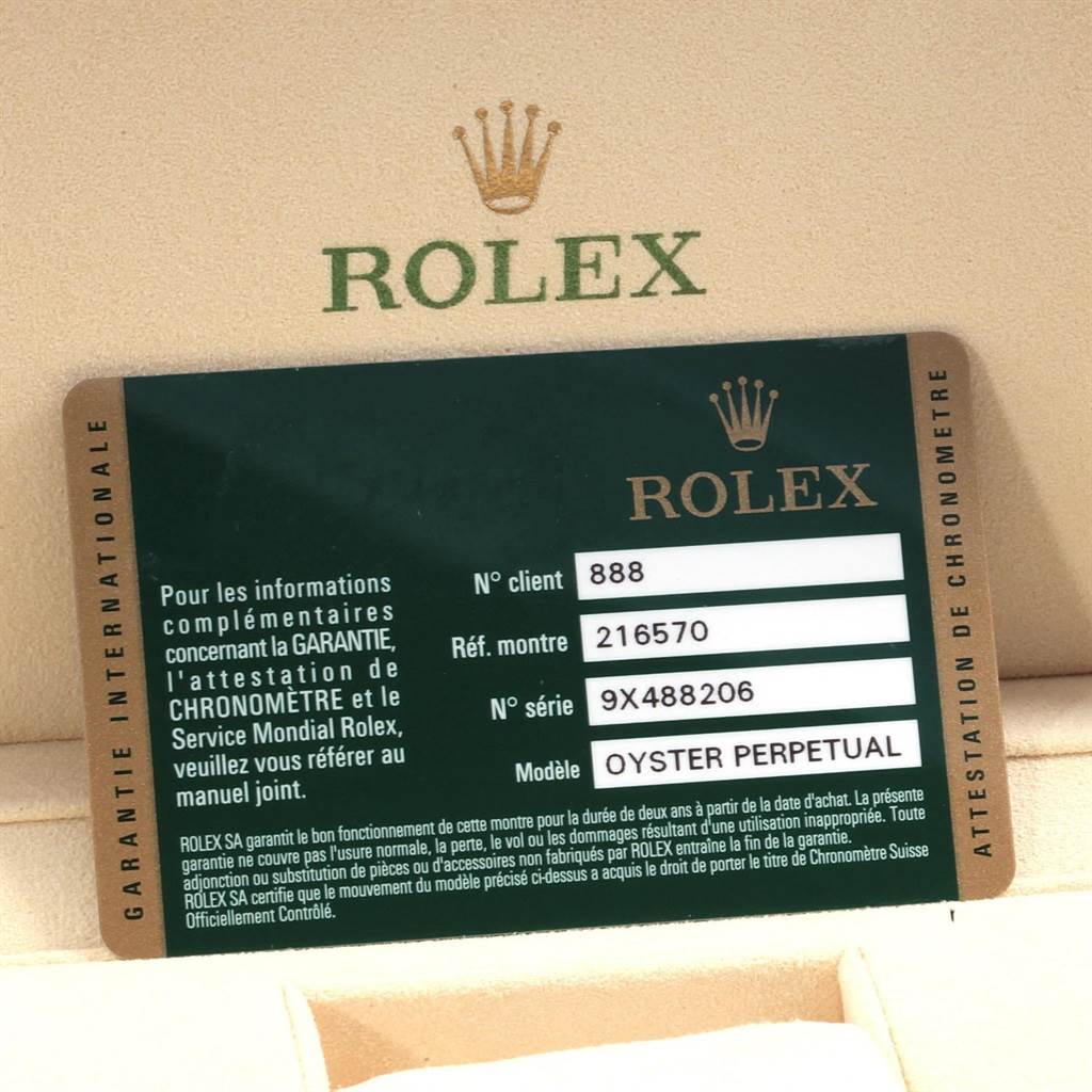 The image shows a warranty card for the Rolex Explorer 216570 Men's Stainless Steel White Dial 216570 Men's Stainless Steel White Dial model with the Rolex logo in the background.