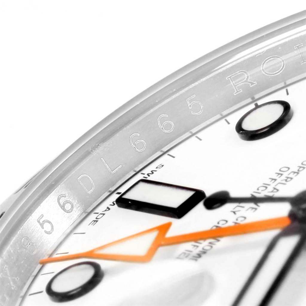 The image shows a close-up view of the face and bezel markings of a Rolex Explorer 216570 Men's Stainless Steel White Dial 216570 Men's Stainless Steel White Dial watch.