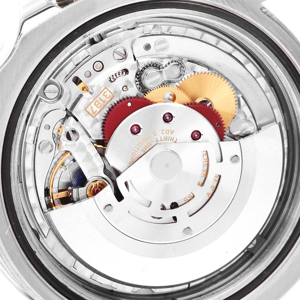 The image shows a close-up view of the intricate internal mechanism of a Rolex Explorer 216570 Men's Stainless Steel White Dial 216570 Men's Stainless Steel White Dial watch.