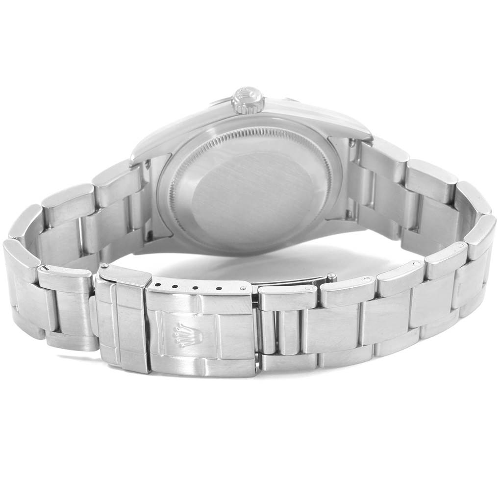 The image shows the backside and bracelet of a Rolex Explorer 114270 Men's Stainless Steel Black Dial 114270 Men's Stainless Steel Black Dial model, focusing on the clasp and case back.