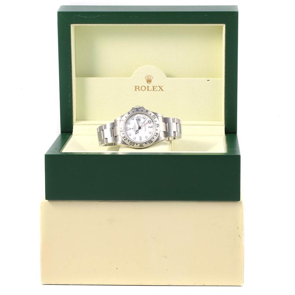 The Rolex Explorer 16570 Men's Stainless Steel White Dial 16570 Men's Stainless Steel White Dial model watch is displayed front-on, seated in an open green and cream Rolex box.