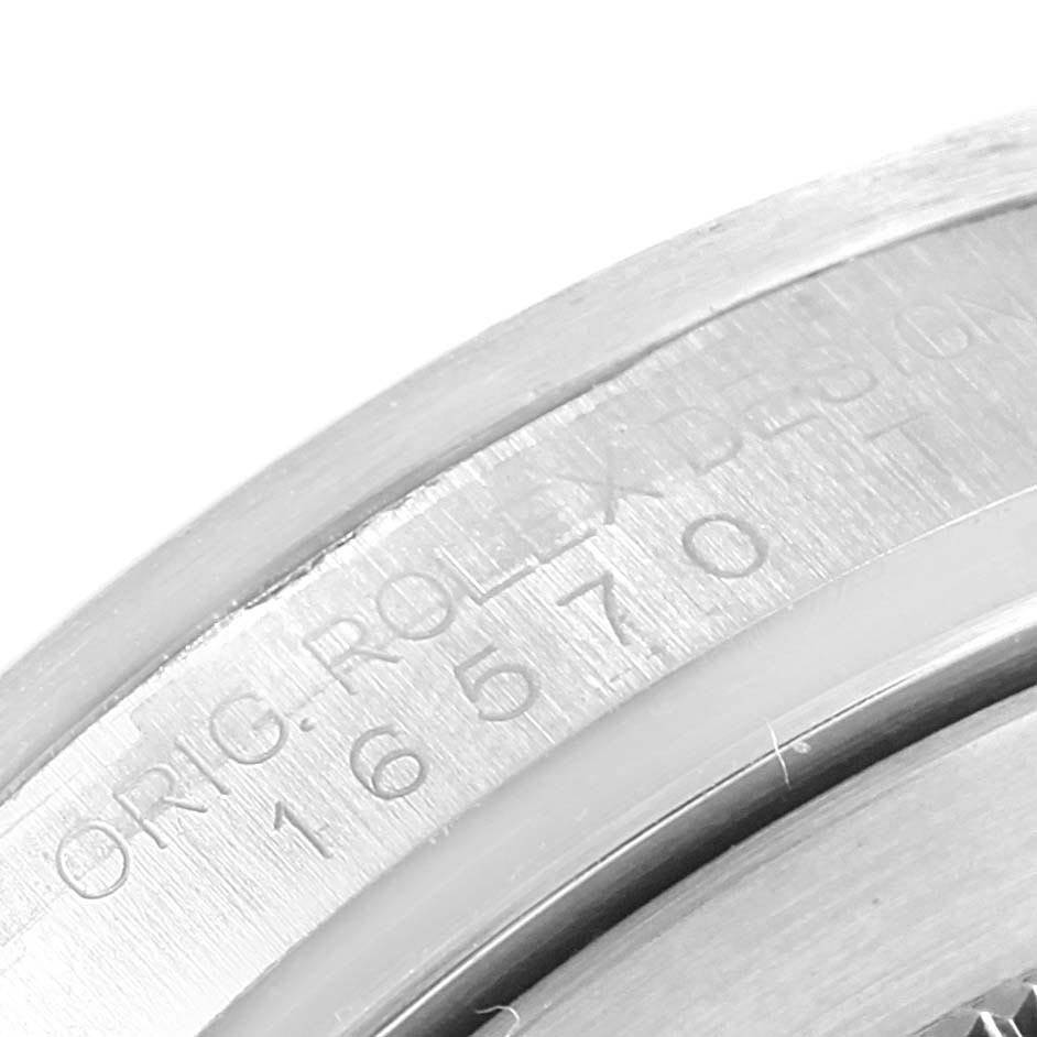 This close-up image shows the engraved model number 16570 on the bezel of a Rolex Explorer 16570 Men's Stainless Steel White Dial 16570 Men's Stainless Steel White Dial watch.