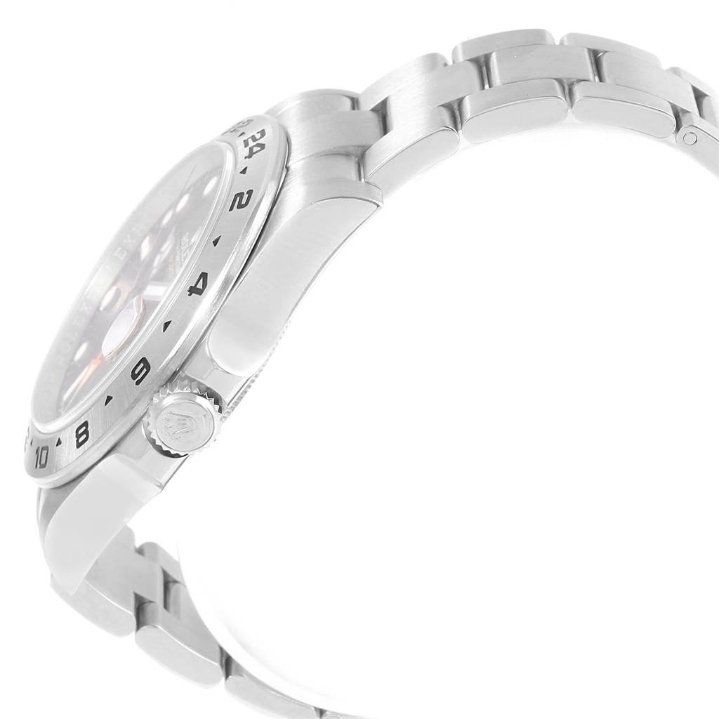 The image shows a side view of a Rolex Explorer 216570 Men's Stainless Steel Black Dial 216570 Men's Stainless Steel Black Dial watch, highlighting the crown, bezel, and part of the metal bracelet.