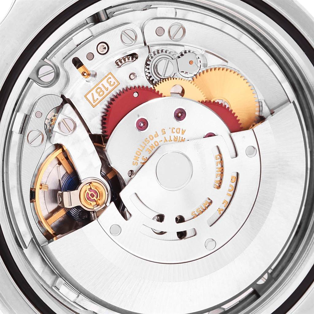 This image shows an angled view of the inner mechanism of the Rolex Explorer 216570 Men's Stainless Steel Black Dial 216570 Men's Stainless Steel Black Dial model watch, highlighting its gears and movement components.