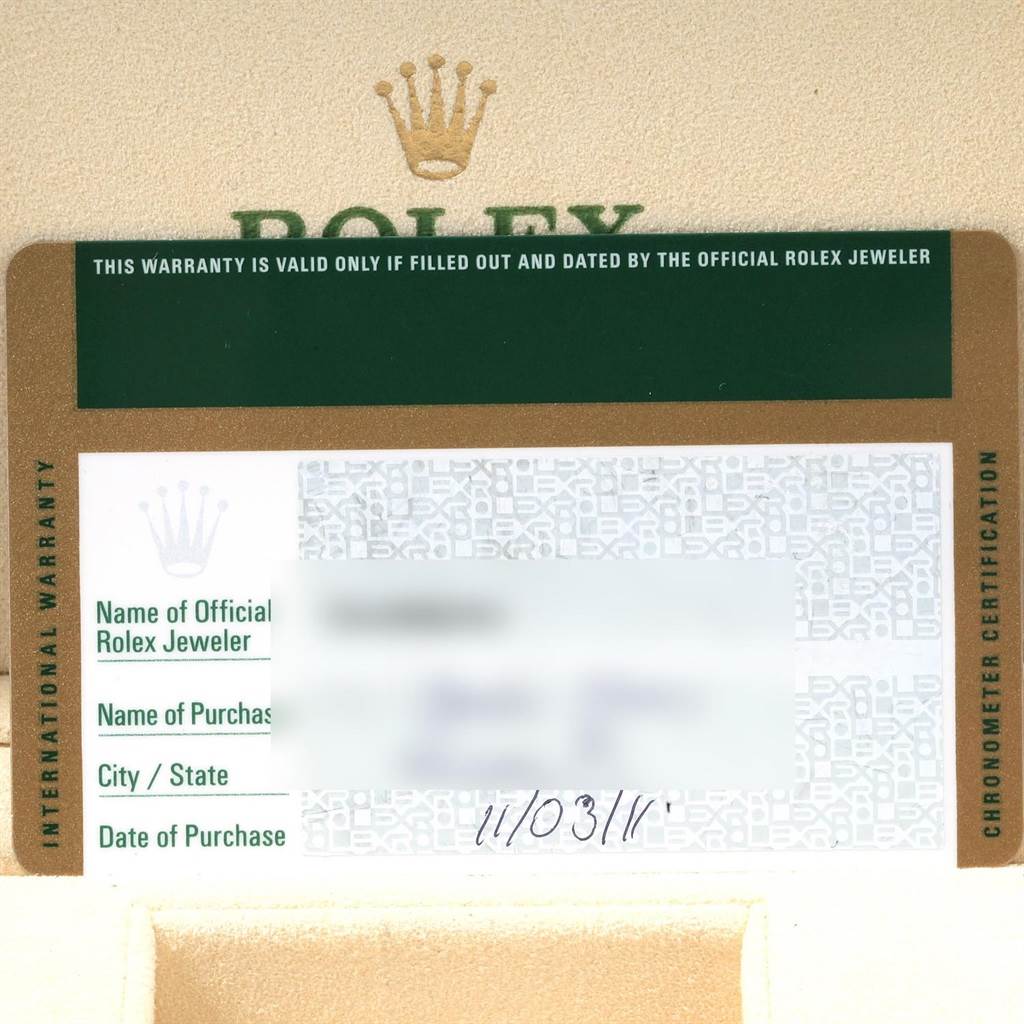 This image shows the warranty card and partial documentation for a Rolex Explorer 216570 Men's Stainless Steel White Dial 216570 Men's Stainless Steel White Dial watch.