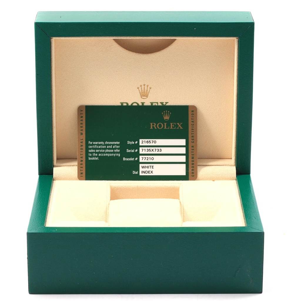 The image shows an open green Rolex box for the Explorer model, with a certification card inside.