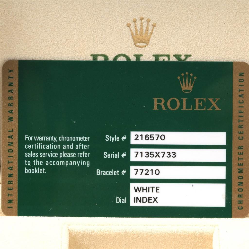 The image shows a close-up of a Rolex Explorer 216570 Men's Stainless Steel White Dial 216570 Men's Stainless Steel White Dial's warranty card, detailing the style, serial, bracelet numbers, and dial type.