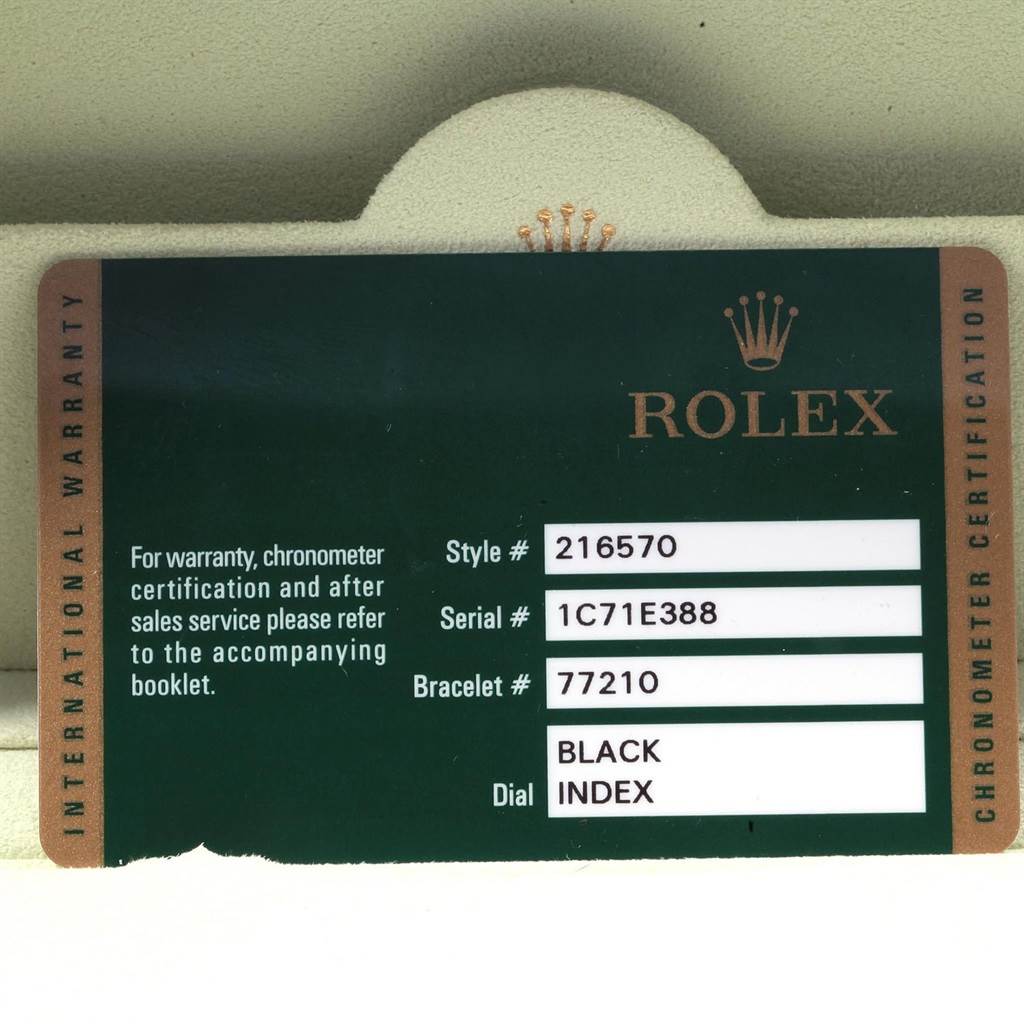 This image shows the warranty card of a Rolex Explorer 216570 Men's Stainless Steel Black Dial 216570 Men's Stainless Steel Black Dial model watch, listing style, serial, and bracelet numbers, along with dial information.