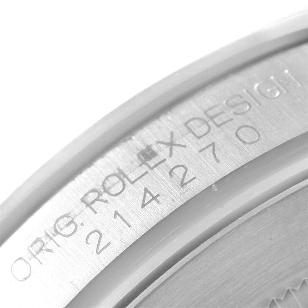 This close-up image shows the back case of a Rolex Explorer 214270 Men
s Stainless Steel Black Dial 214270 Men
s Stainless Steel Black Dial model, highlighting the engraving of the model number.