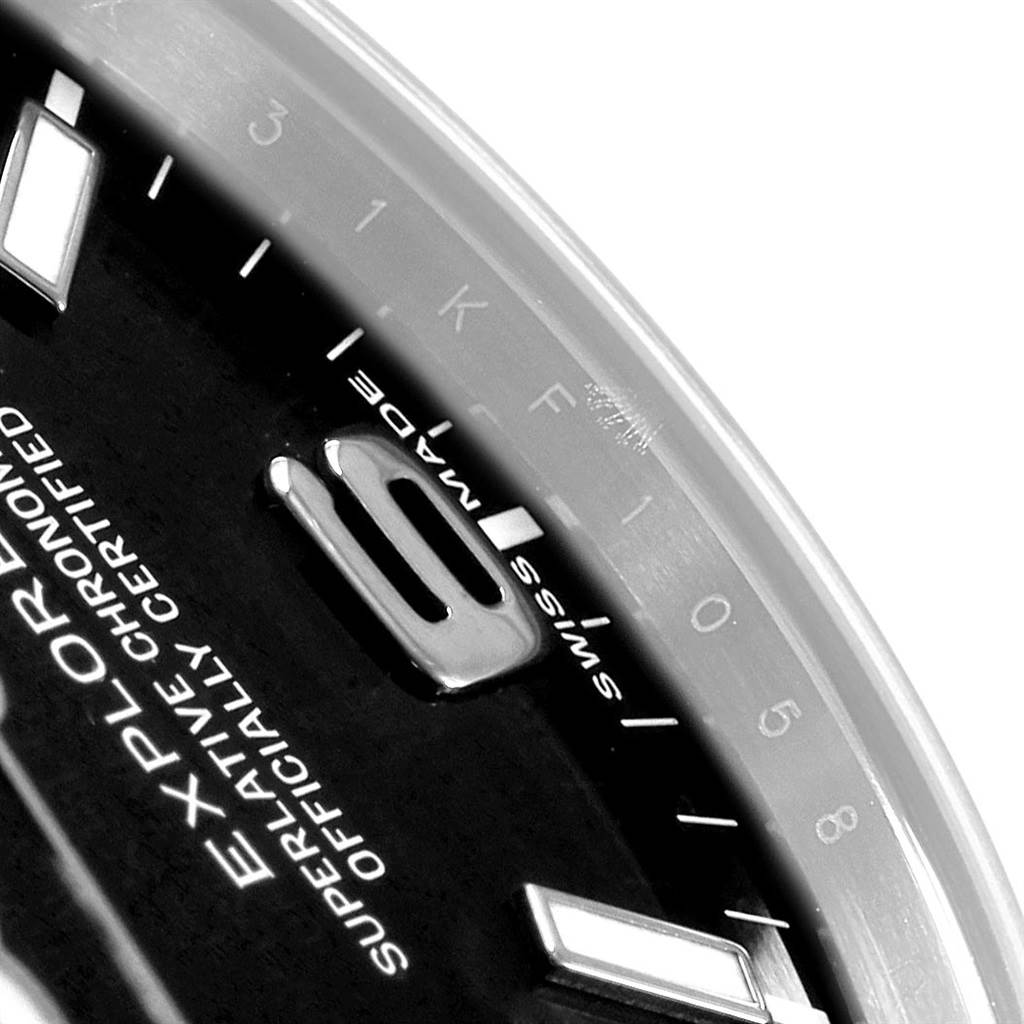 This close-up image of the Rolex Explorer 214270 Men
s Stainless Steel Black Dial 214270 Men
s Stainless Steel Black Dial model shows part of its dial, including indices and markings.