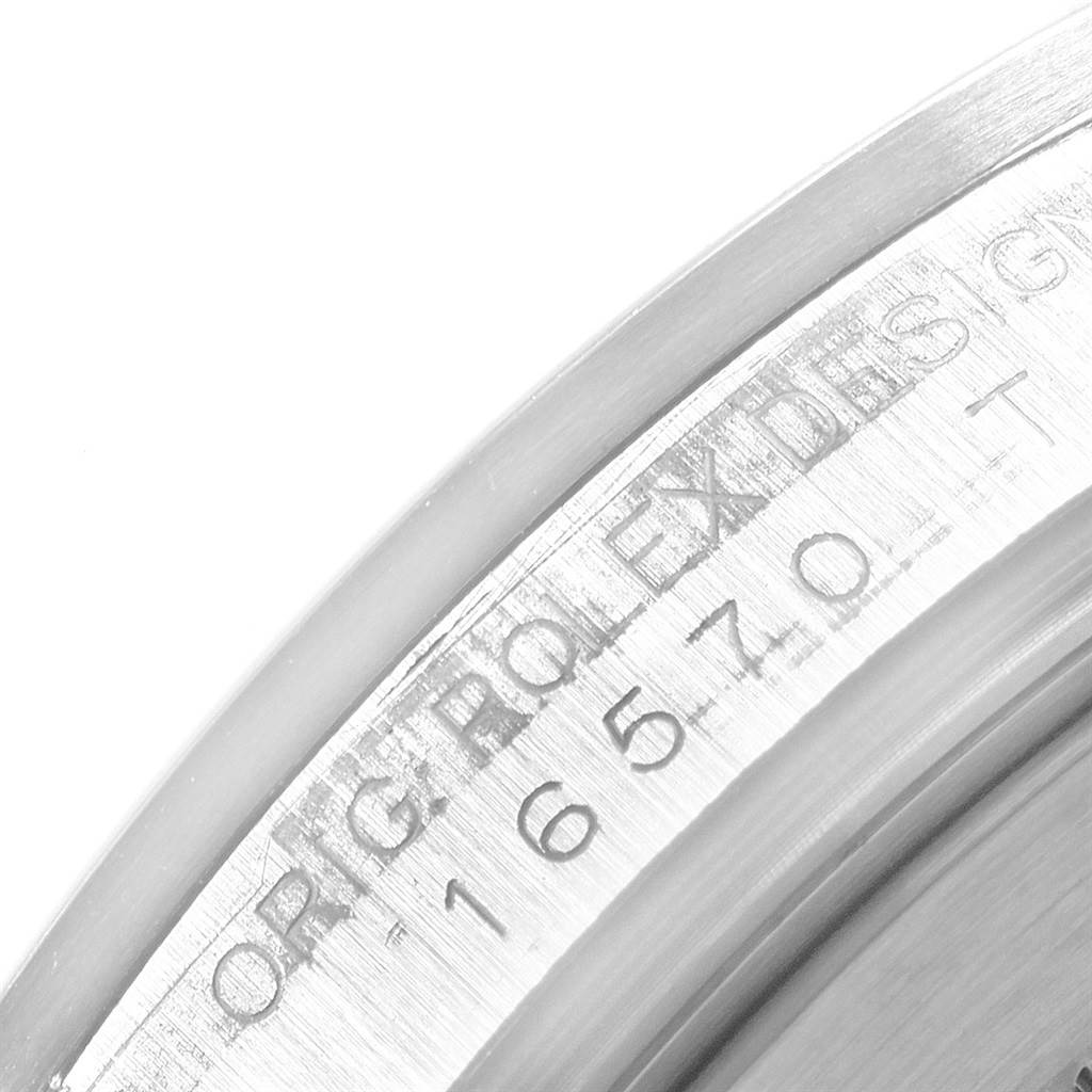 This is a close-up view of the case wall with engraved markings of a Rolex Explorer 16570 Men's Stainless Steel White Dial 16570 Men's Stainless Steel White Dial watch.