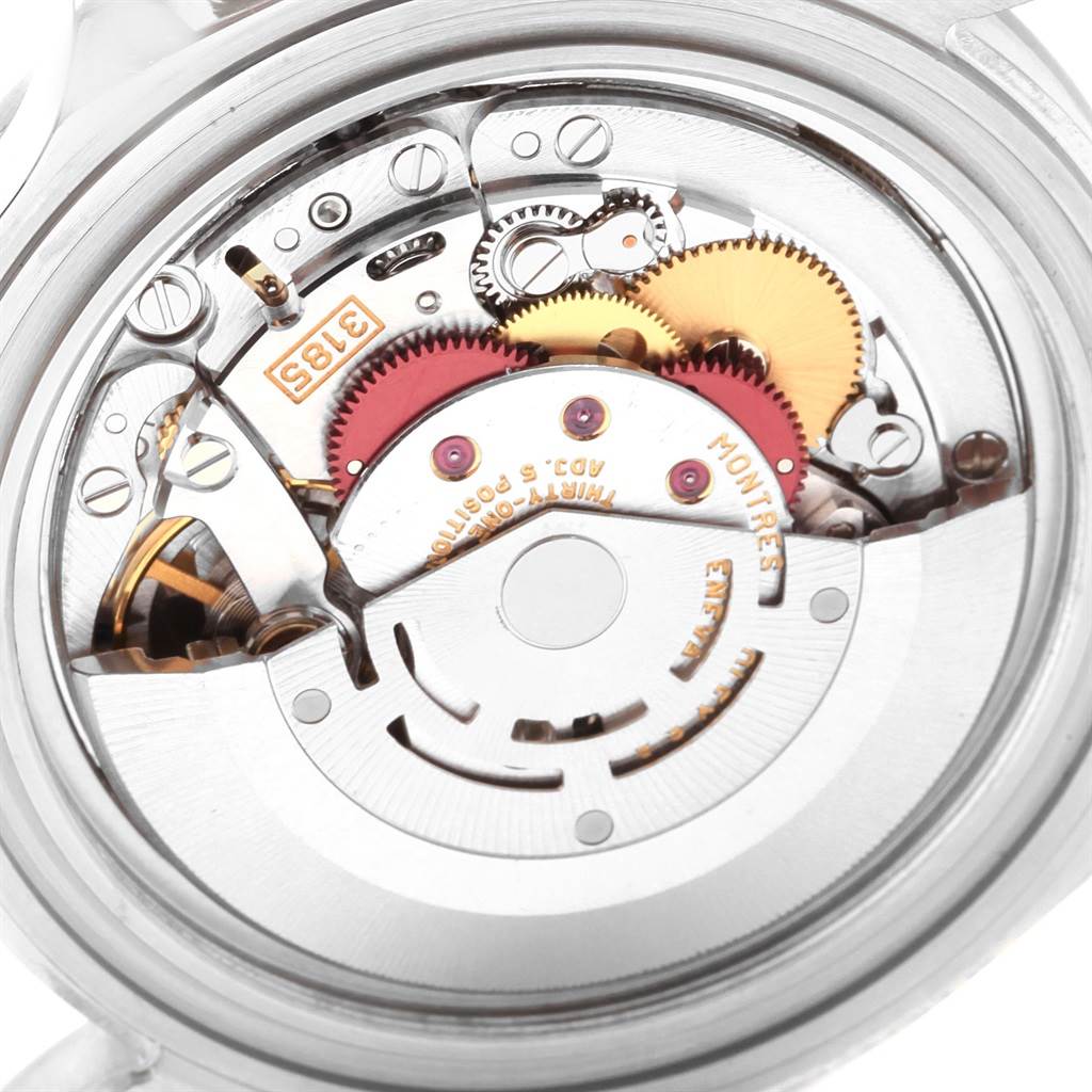 The image shows the back view of the Rolex Explorer 16570 Men's Stainless Steel White Dial 16570 Men's Stainless Steel White Dial model, revealing its intricate automatic movement and gears.