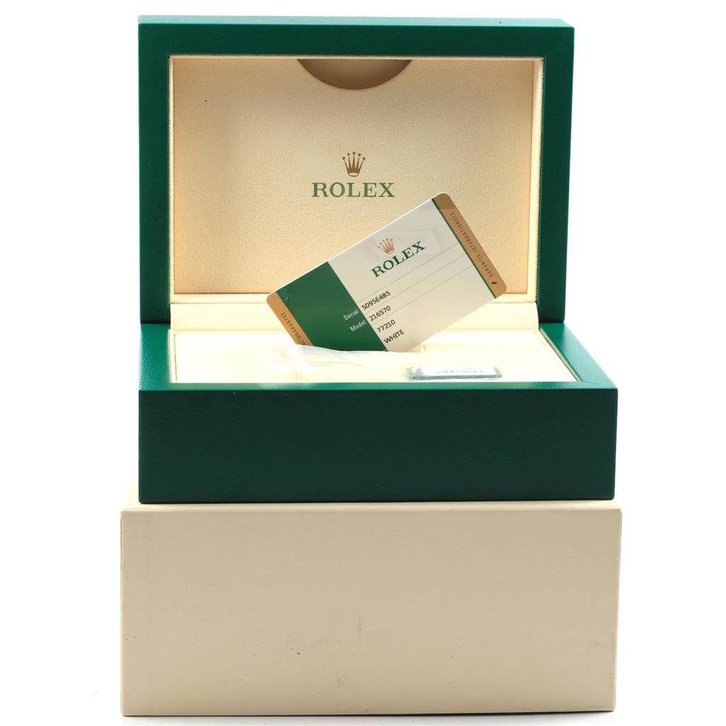 The image shows an open Rolex box for the Explorer model with a card and tag inside.
