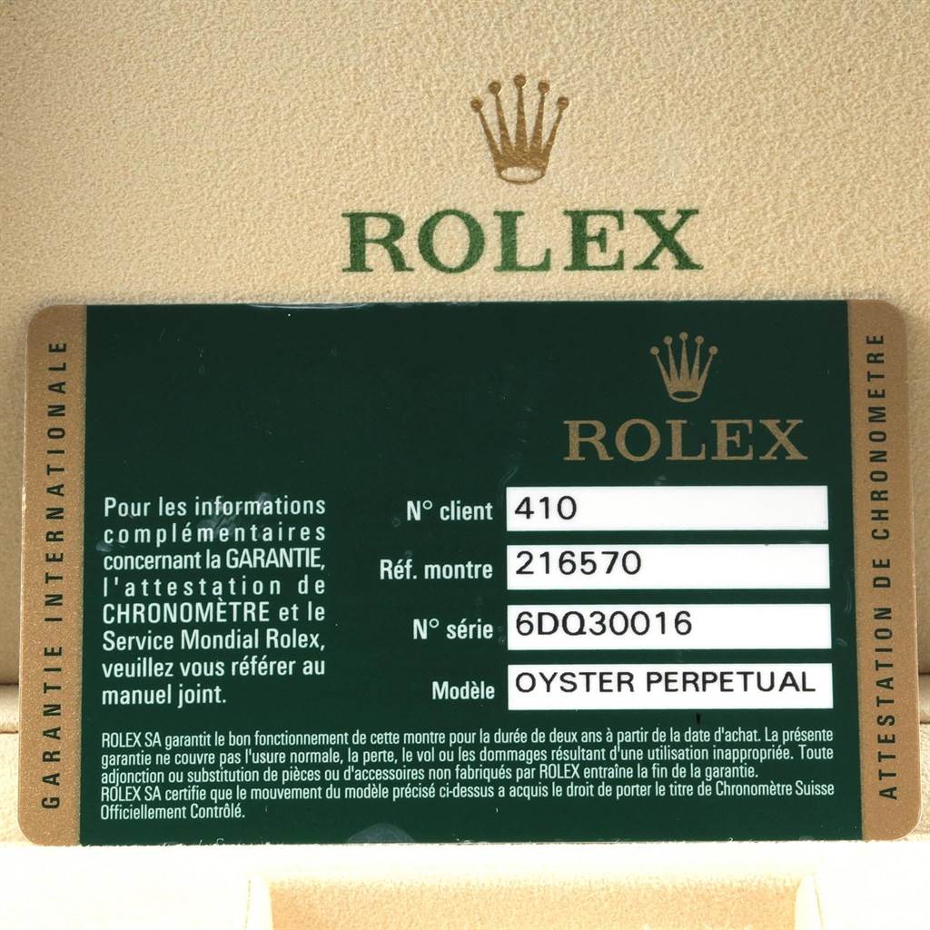 The image shows a Rolex international guarantee card for the Explorer model with details of the reference number and serial number.
