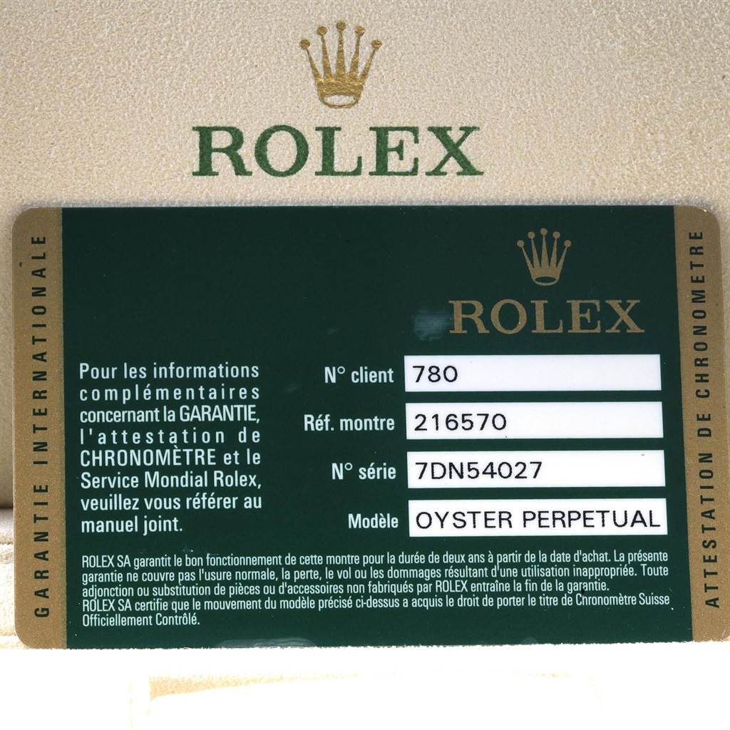 The image shows a Rolex warranty card for the Explorer model, detailing the client's number, reference number, and serial number.