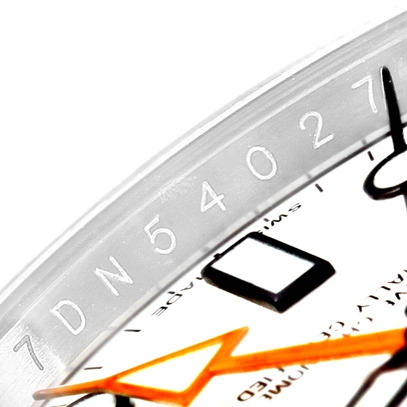 The image shows a close-up of the dial and bezel with a serial number from a Rolex Explorer 216570 Men's Stainless Steel White Dial 216570 Men's Stainless Steel White Dial watch.