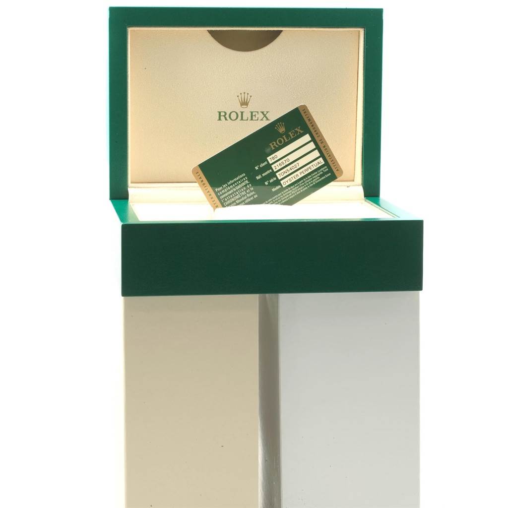 The image shows the open box and warranty card for a Rolex Explorer 216570 Men's Stainless Steel White Dial 216570 Men's Stainless Steel White Dial model watch.