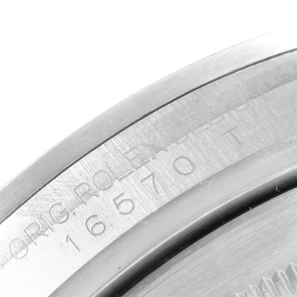 The image shows an angled close-up of the case back edge of a Rolex Explorer 16570 Men's Stainless Steel Black Dial 16570 Men's Stainless Steel Black Dial watch, displaying the model number 16570T.