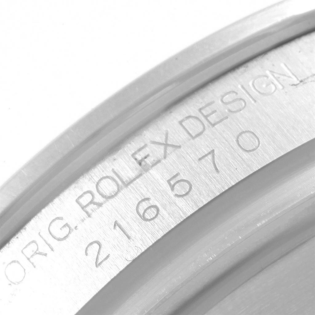 This image shows a close-up of the model number and branding engraved on the side of a Rolex Explorer 216570 Men's Stainless Steel White Dial 216570 Men's Stainless Steel White Dial watch.