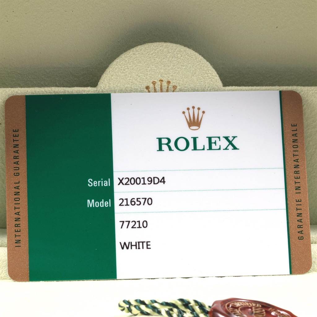 The image shows an international guarantee card for the Rolex Explorer 216570 Men's Stainless Steel White Dial 216570 Men's Stainless Steel White Dial model 216570.
