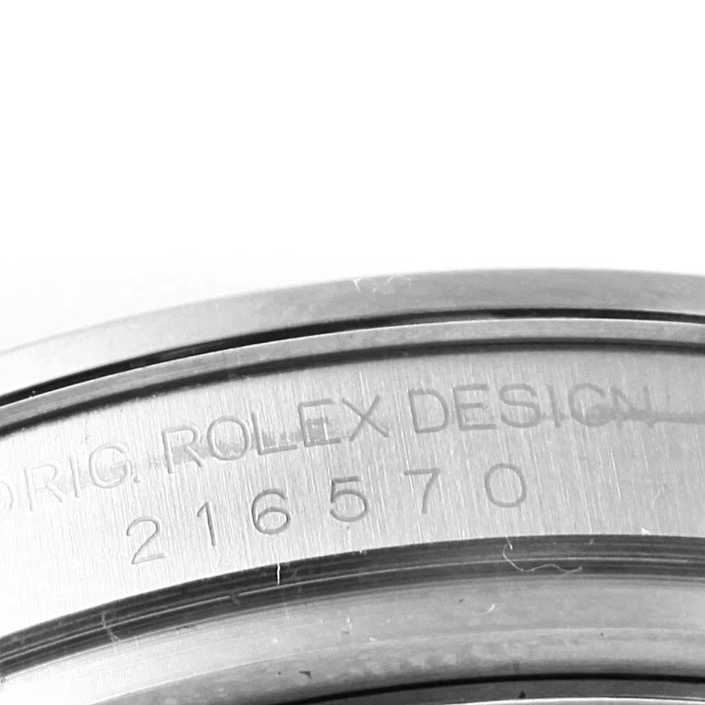 The image shows a close-up of the engraved model number on the casing of a Rolex Explorer 216570 Men's Stainless Steel White Dial 216570 Men's Stainless Steel White Dial.