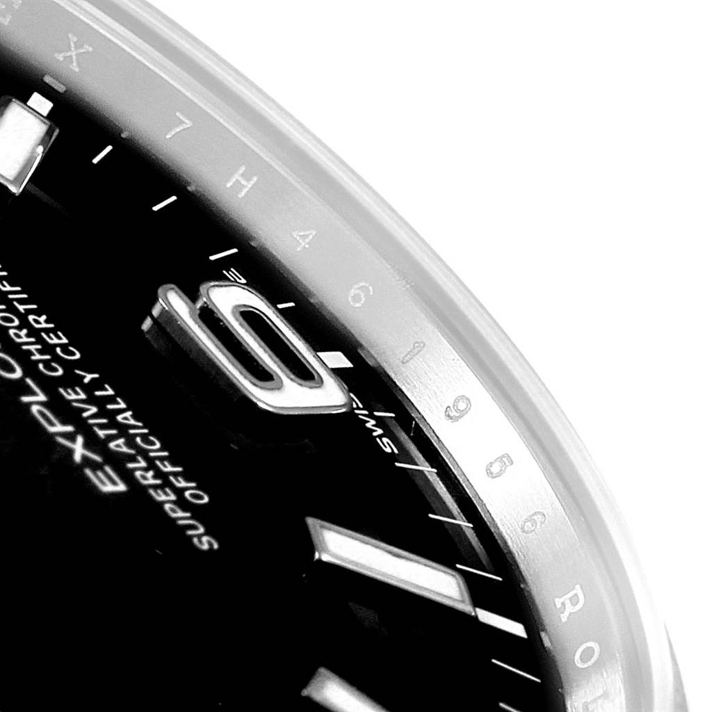 Close-up view of the dial and bezel of a Rolex Explorer 214270 Men's Stainless Steel Black Dial 214270 Men's Stainless Steel Black Dial watch, showing the '9' numeral, indices, and part of the Rolex branding.