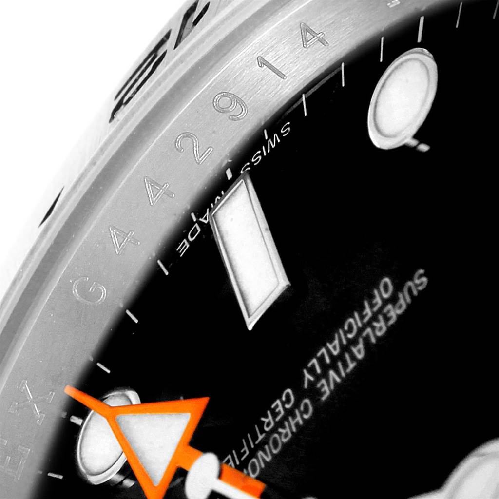 The close-up image shows part of the dial, bezel, and orange hand of a Rolex Explorer 216570 Men's Stainless Steel Black Dial 216570 Men's Stainless Steel Black Dial watch.