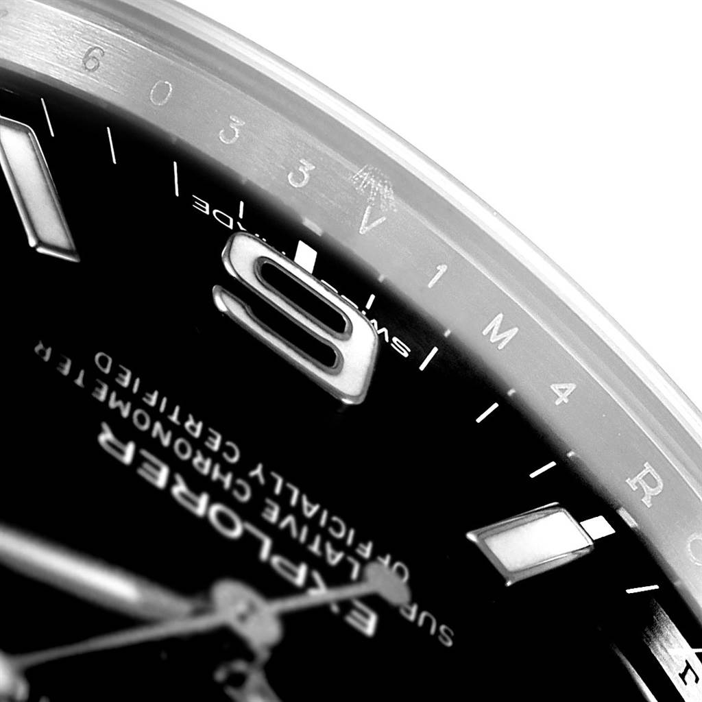 The image shows a close-up of the dial and bezel of the Rolex Explorer 214270 Men's Stainless Steel Black Dial 214270 Men's Stainless Steel Black Dial watch, focusing on the numerals and text.