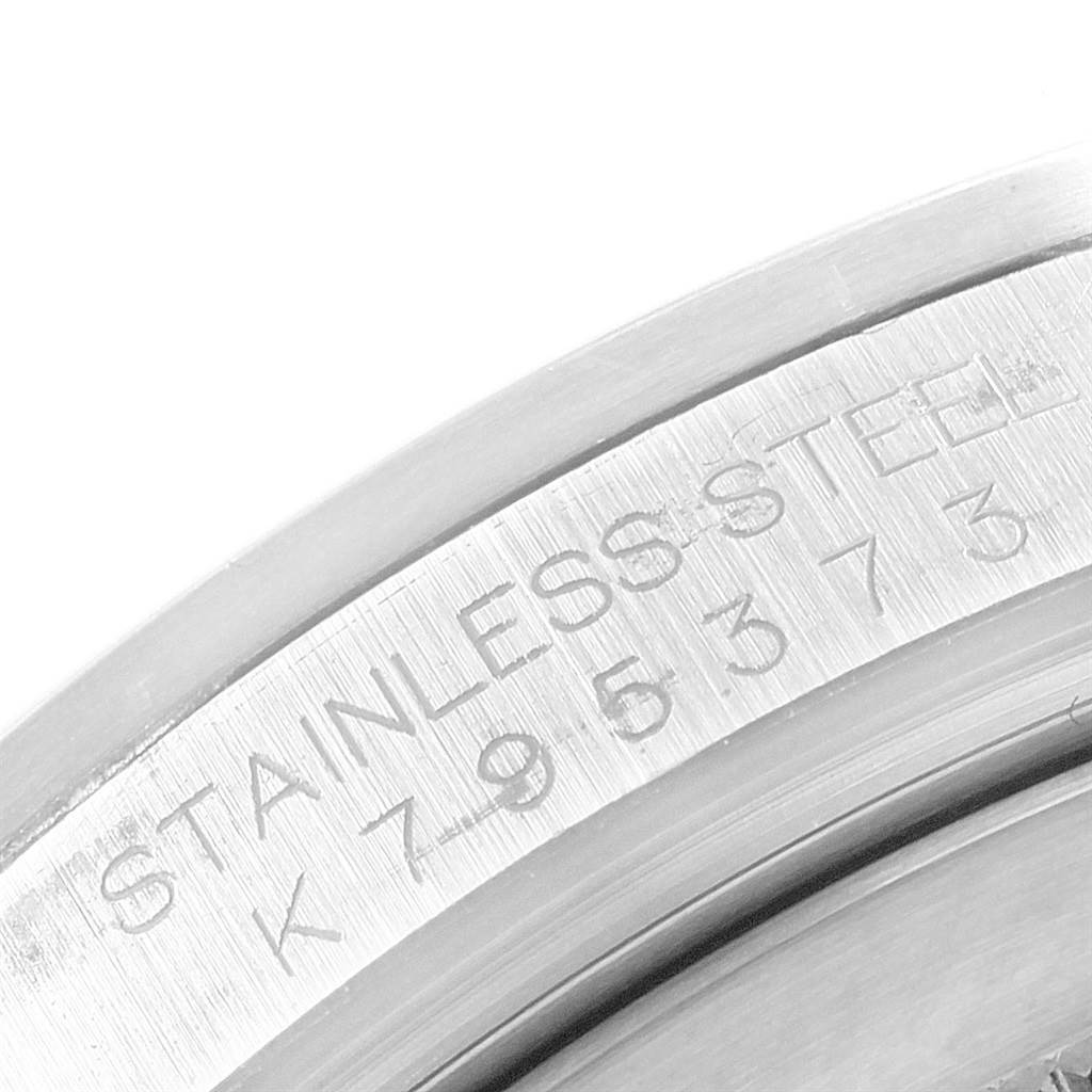 The image shows a close-up of the stainless steel caseback and serial number engraving on the Rolex Explorer 16570 Men's Stainless Steel White Dial 16570 Men's Stainless Steel White Dial watch.