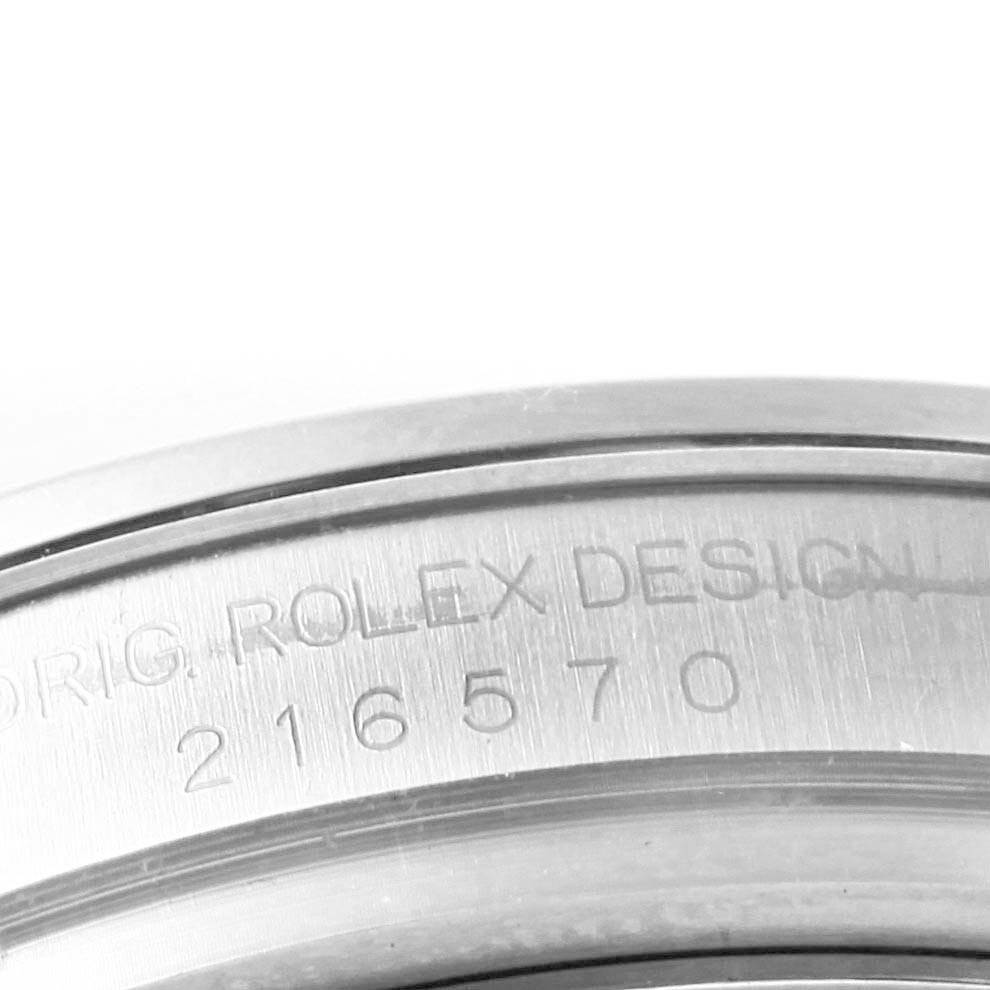 The image shows a close-up of the case side on a Rolex Explorer 216570 Men's Stainless Steel White Dial 216570 Men's Stainless Steel White Dial watch with the model number 216570 engraved.