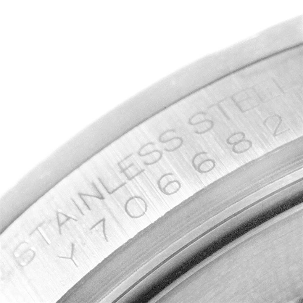 The image shows a close-up of the engraved stainless steel case back of a Rolex Explorer 16570 Men
s Stainless Steel Black Dial 16570 Men
s Stainless Steel Black Dial watch.