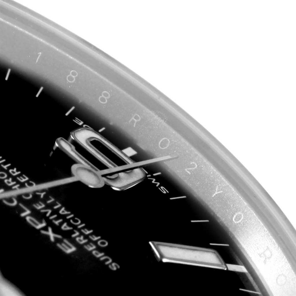The image shows a close-up of the dial and hands of a Rolex Explorer 214270 Men's Stainless Steel Black Dial 214270 Men's Stainless Steel Black Dial watch.
