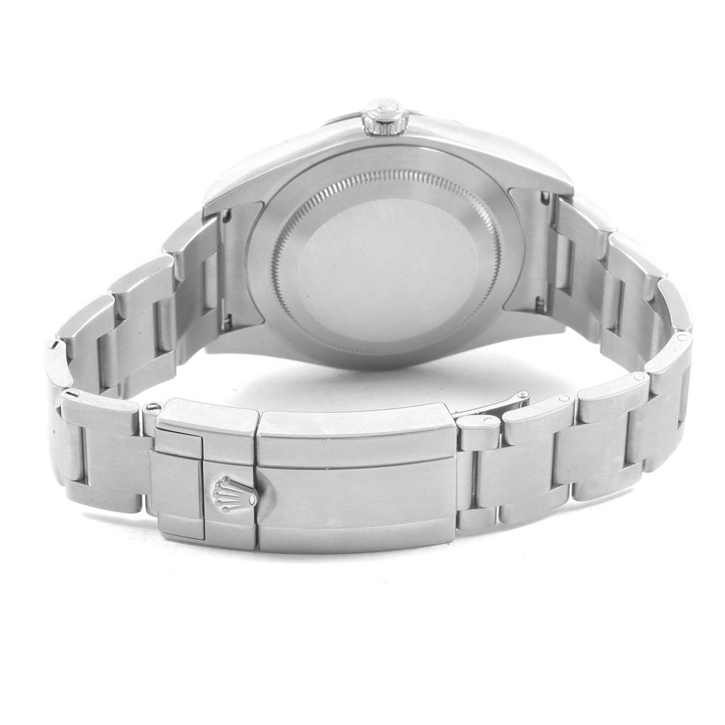 The image shows the back case, crown, and bracelet clasp of a Rolex Explorer 214270 Men's Stainless Steel Black Dial 214270 Men's Stainless Steel Black Dial model watch. 