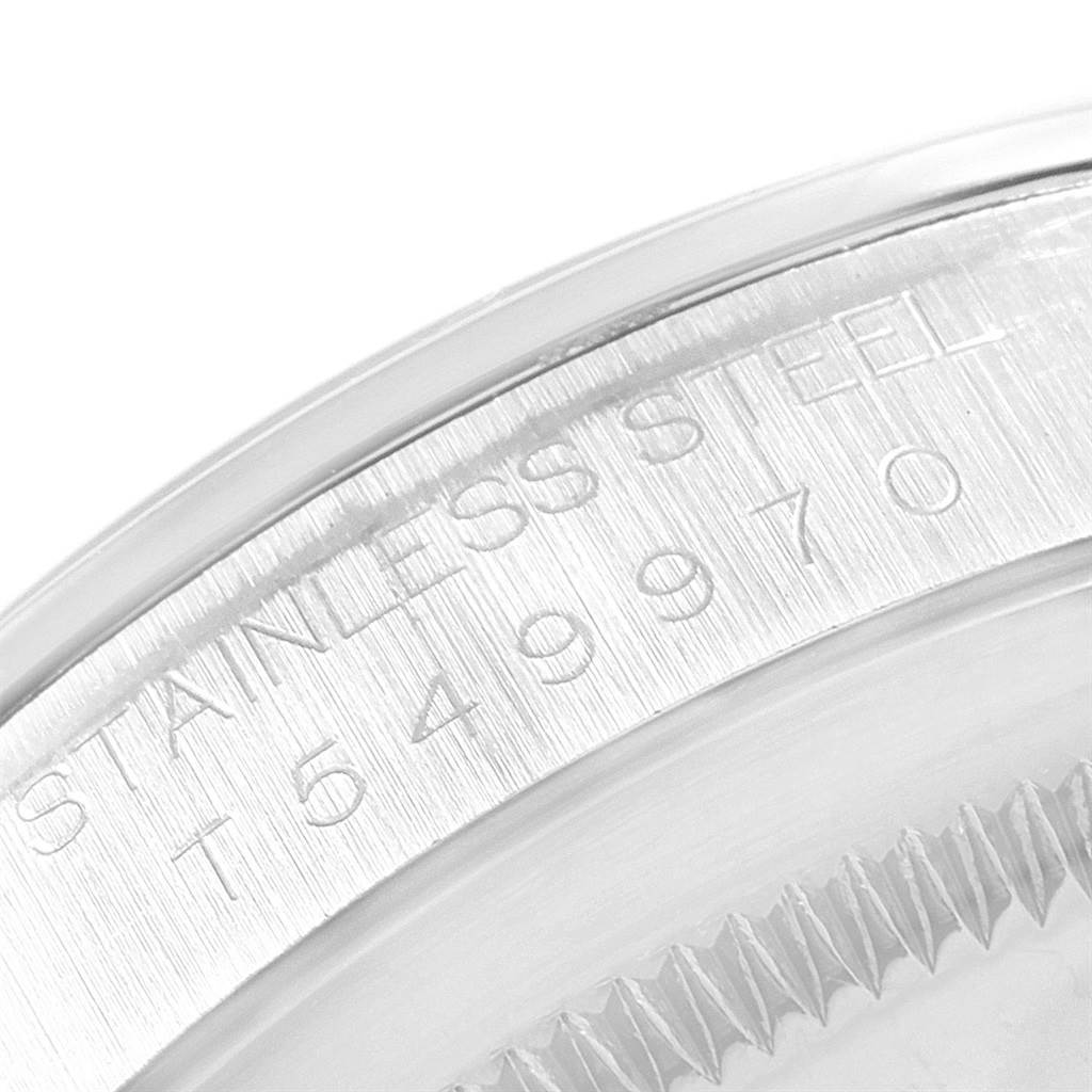 The image shows a close-up of the case back edge of a Rolex Explorer 14270 Men
s Stainless Steel Black Dial 14270 Men
s Stainless Steel Black Dial watch, highlighting the engraving on the stainless steel.