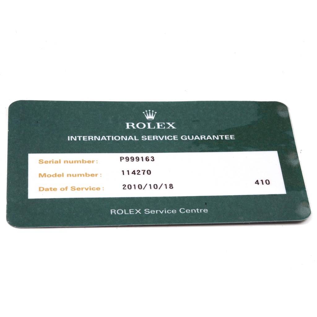 The image shows an International Service Guarantee card for the Rolex Explorer 114270 Men's Stainless Steel Black Dial 114270 Men's Stainless Steel Black Dial model 114270.
