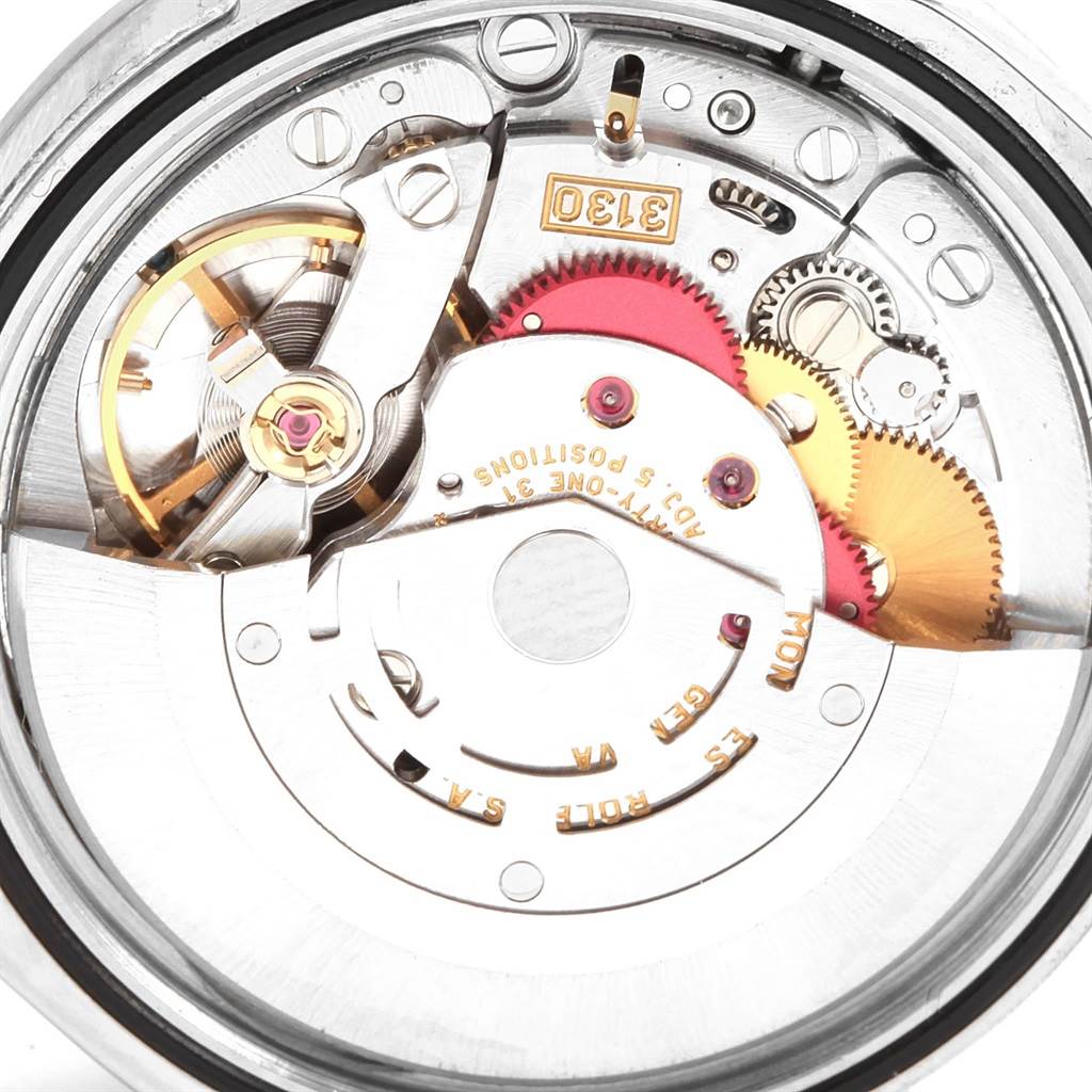 This image displays the intricate internal components of the Rolex Explorer 114270 Men's Stainless Steel Black Dial 114270 Men's Stainless Steel Black Dial watch, showcasing its movement and gears.