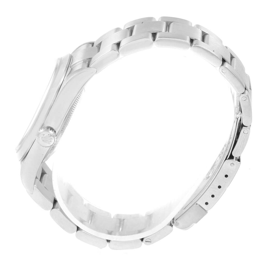 The image shows a side profile of a Rolex Explorer 114270 Men's Stainless Steel Black Dial 114270 Men's Stainless Steel Black Dial watch, with focus on the crown and metal bracelet.