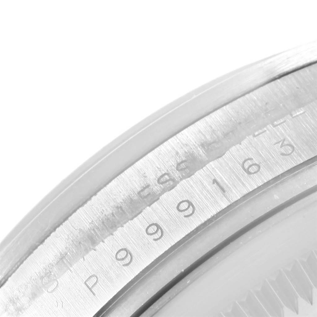 The image shows a close-up of the case back and serial number of a Rolex Explorer 114270 Men's Stainless Steel Black Dial 114270 Men's Stainless Steel Black Dial watch.