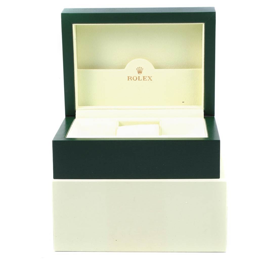 The image shows an open green and cream box for the Rolex Explorer 16570 Men
s Stainless Steel White Dial 16570 Men
s Stainless Steel White Dial model, displaying the interior with the Rolex logo.