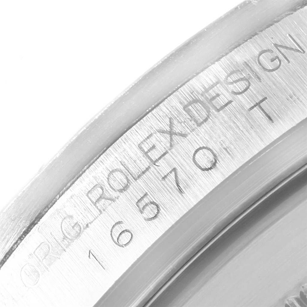 The image shows a close-up of the engraved inner case back of a Rolex Explorer 16570 Men
s Stainless Steel White Dial 16570 Men
s Stainless Steel White Dial watch.