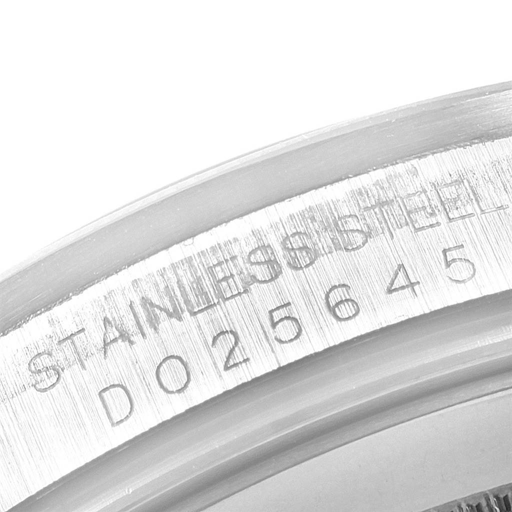 This image shows a close-up of the stainless steel case and engraved serial number of the Rolex Explorer 16570 Men's Stainless Steel White Dial 16570 Men's Stainless Steel White Dial watch.