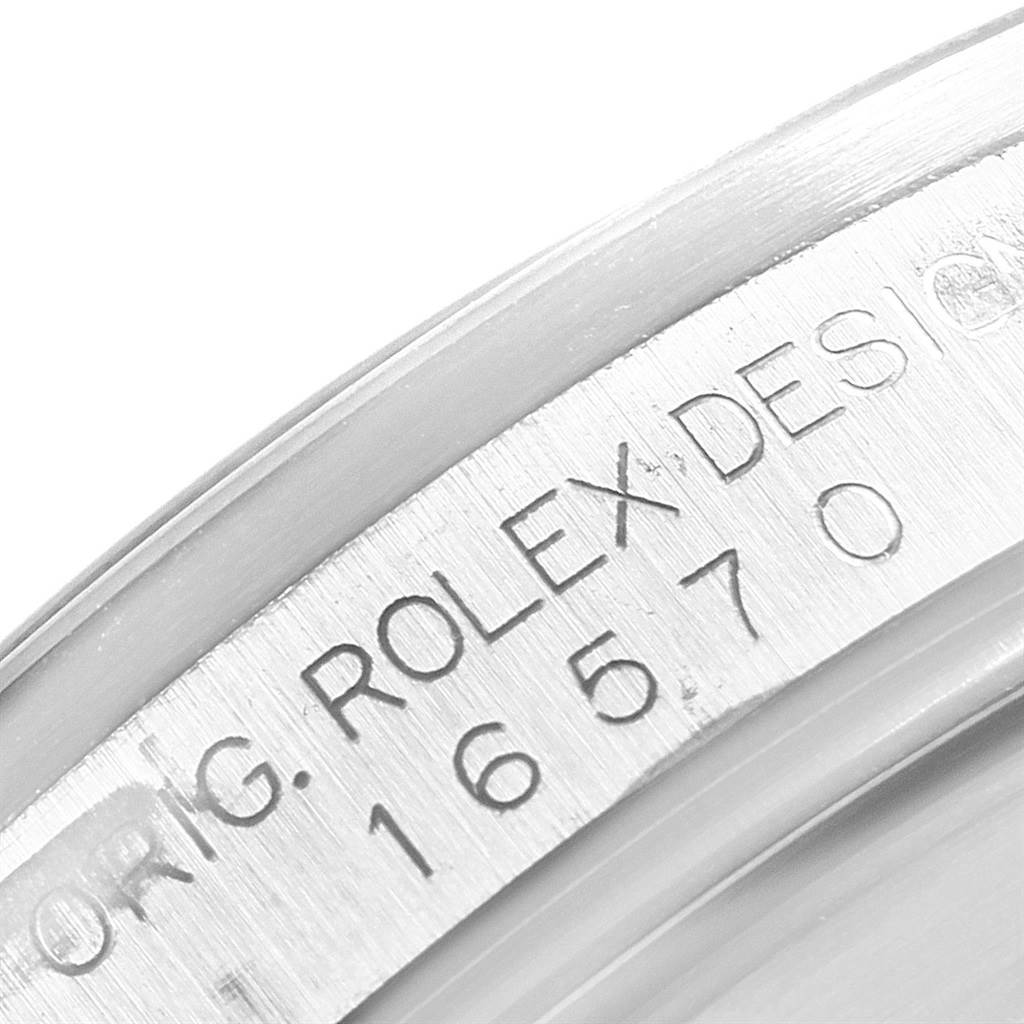The image shows a close-up of the engravings on the case of a Rolex Explorer 16570 Men's Stainless Steel White Dial 16570 Men's Stainless Steel White Dial watch, model number 16570.