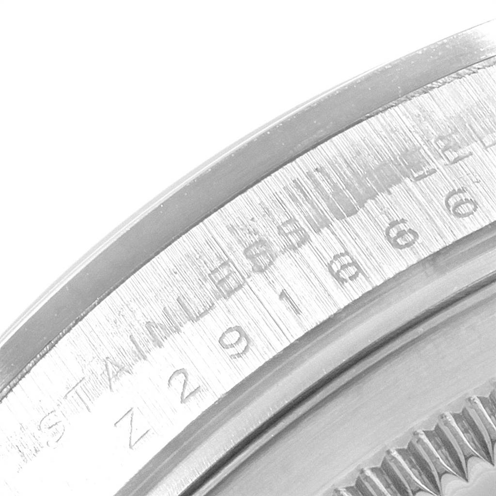 This close-up image shows the engraved case back of a Rolex Explorer 114270 Men's Stainless Steel Black Dial 114270 Men's Stainless Steel Black Dial watch, focusing on the model and serial numbers.